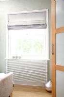 Window with roman blind in bedroom