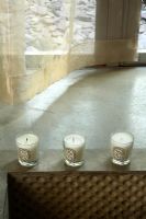 Detail of sunken bath with candles on side