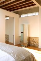 Contemporary bedroom with exposed brickwork