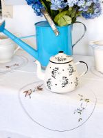 Floral teapot on table