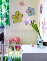 Childrens bedroom with flowers painted on wall