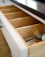 Detail of open kitchen cutlery drawer