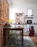 Modern kitchen with exposed brick wall