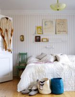 Country style bedroom with wallpapered walls 