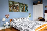 Bedroom with blue painted walls 