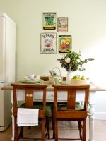 Country style dining room with green painted walls