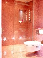 Modern bathroom with pink mosaic tiles