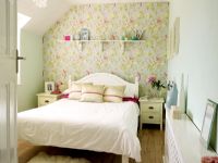 Modern bedroom with wallpapered feature wall