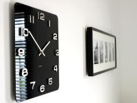Detail of black clock on wall