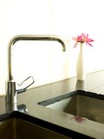 Detail of kitchen sink and corian worktop
