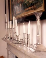 Detail of mantelpiece with silver candlesticks