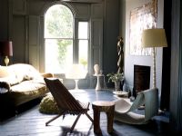 Grey living room with painted walls and floorboards 