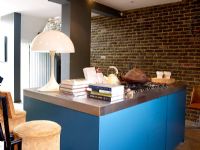 Contemporary kitchen with exposed brick wall