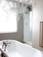Contemporary bathroom with roll top bath