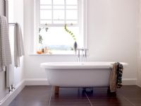 Contemporary bathroom with freestanding roll top bath