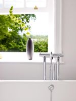 Detail of taps on roll top bath