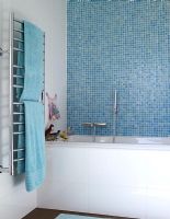 Modern bathroom with mosaic wall and towel radiator