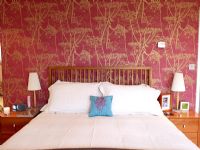 Modern bedroom with wallpapered feature wall 