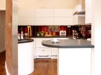 Modern kitchen with curved worktops