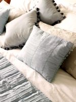 Assortment of cushions on bed