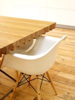 Detail of dining table and Charles Eames dining chair 