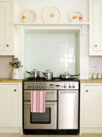 Range cooker in country style kitchen 