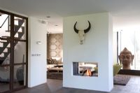 Central fireplace in modern living room 
