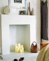 Detil of fireplace with candles 