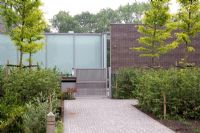 Exterior paved path to contemporary house 
WAITING FOR HI-RES 