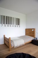 Modern bedroom with barcode painted wall