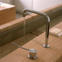Closeup of chrome sink tap in bathroom