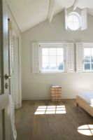 View of bedroom with sunlight through window