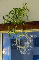 Mistletoe hanging over door 