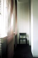 Chair by window with blinds
