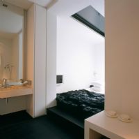 Sink in en-suite bathroom beside bedrooms
