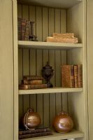 Books on shelf in cupboard