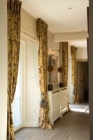 Corridor with floral curtains