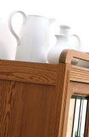 Close-up of cabinet with jugs