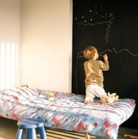Child drawing on a blackboard