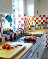 Modern kitchen with red and white tiles