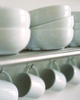 White bowls and mugs in kitchen