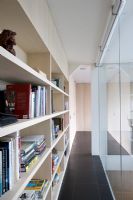 Bookshelves on modern mezzanine corridor 