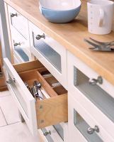 Modern kitchen with open cutlery drawer