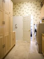 Shower bathroom with storage cupboards and washing machine