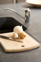 Detail of a cutting board with onions