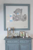 Childs bedroom dresser with teddy bear artwork