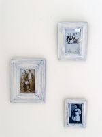 Detail photographs in frames on wall