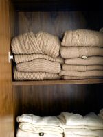 Clothes folded in wardrobe 