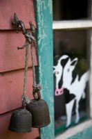 Cow bells outside country house 