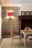 Patterned wallpaper in classic dining room 